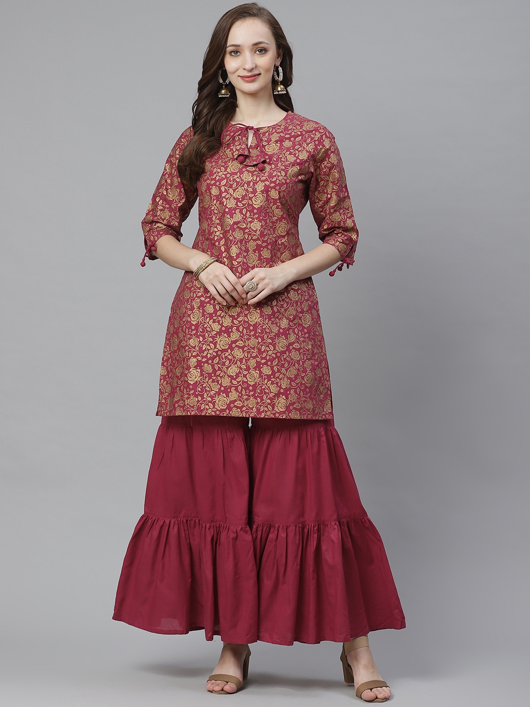 

Bhama Couture Women Burgundy & Golden Floral Screen Printed Kurta with Sharara