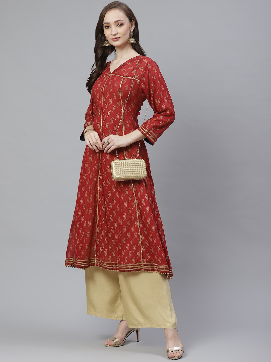 

Bhama Couture Women Maroon & Golden Quirky Block Printed A-Line Kurta