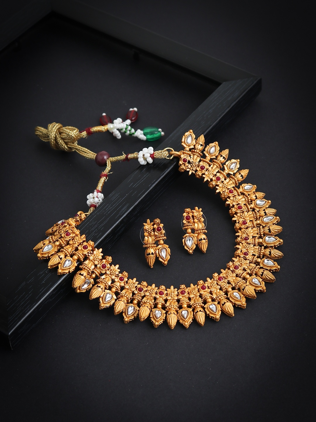 

Sukkhi Gold-Plated Red & White Stone-Studded Antique Jewellery Set