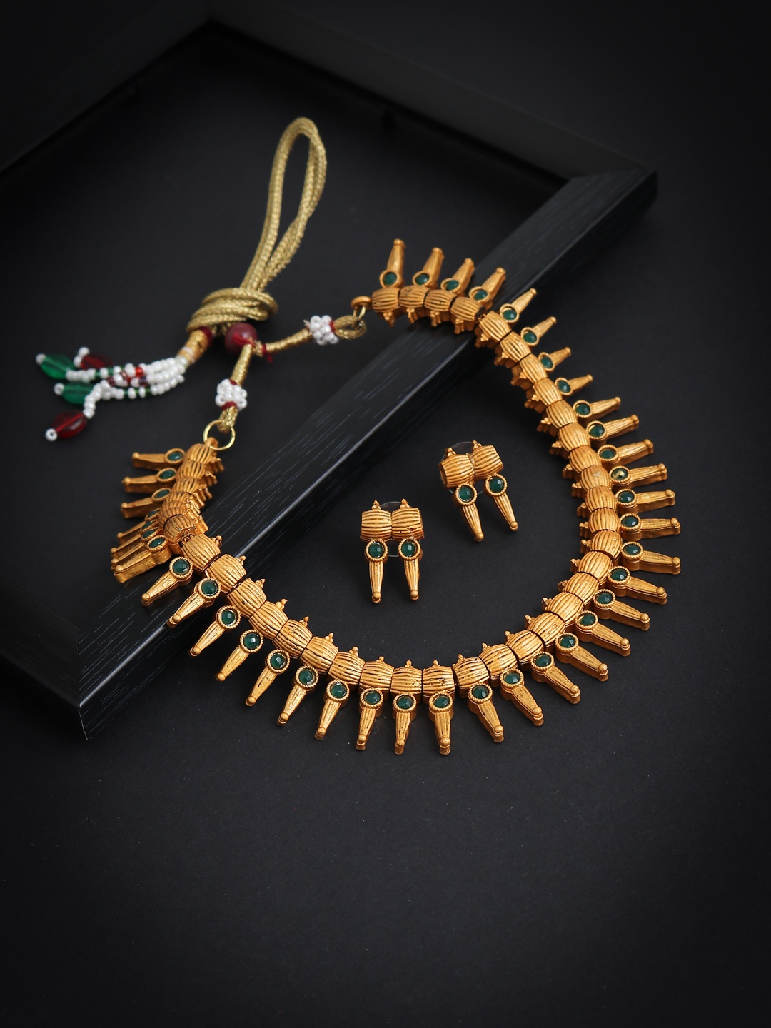 

Sukkhi Gold-Plated Green Stone-Studded Antique Jewellery Set