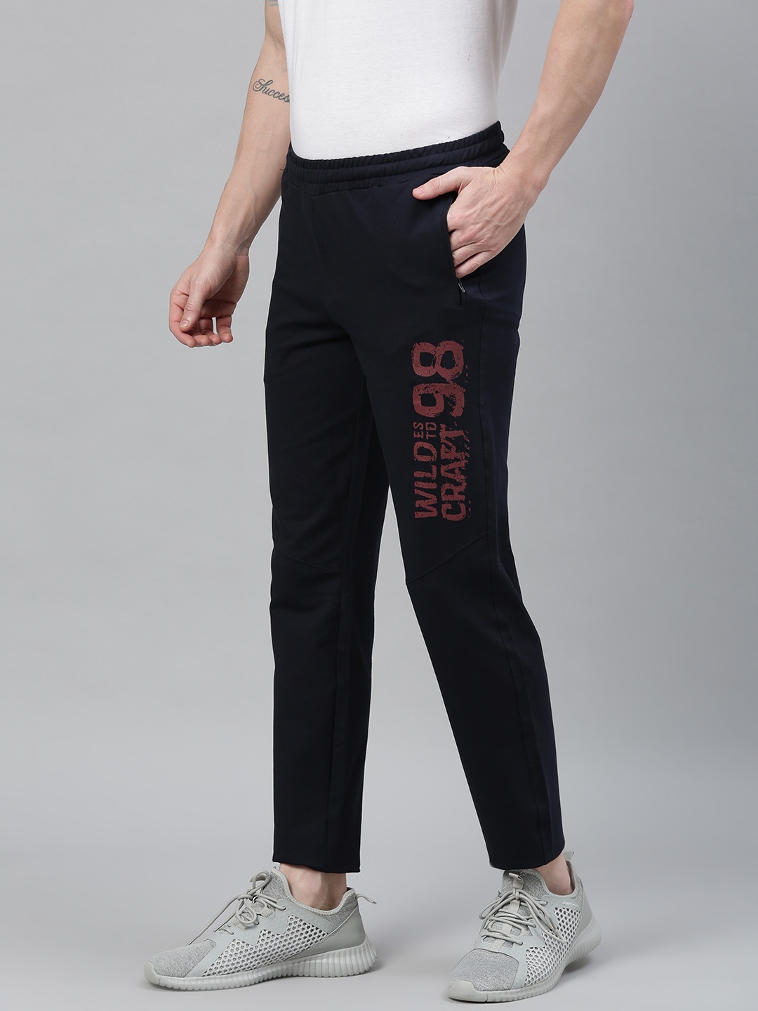 

Wildcraft Men Navy Blue Solid Cropped Track Pants with Printed Detail