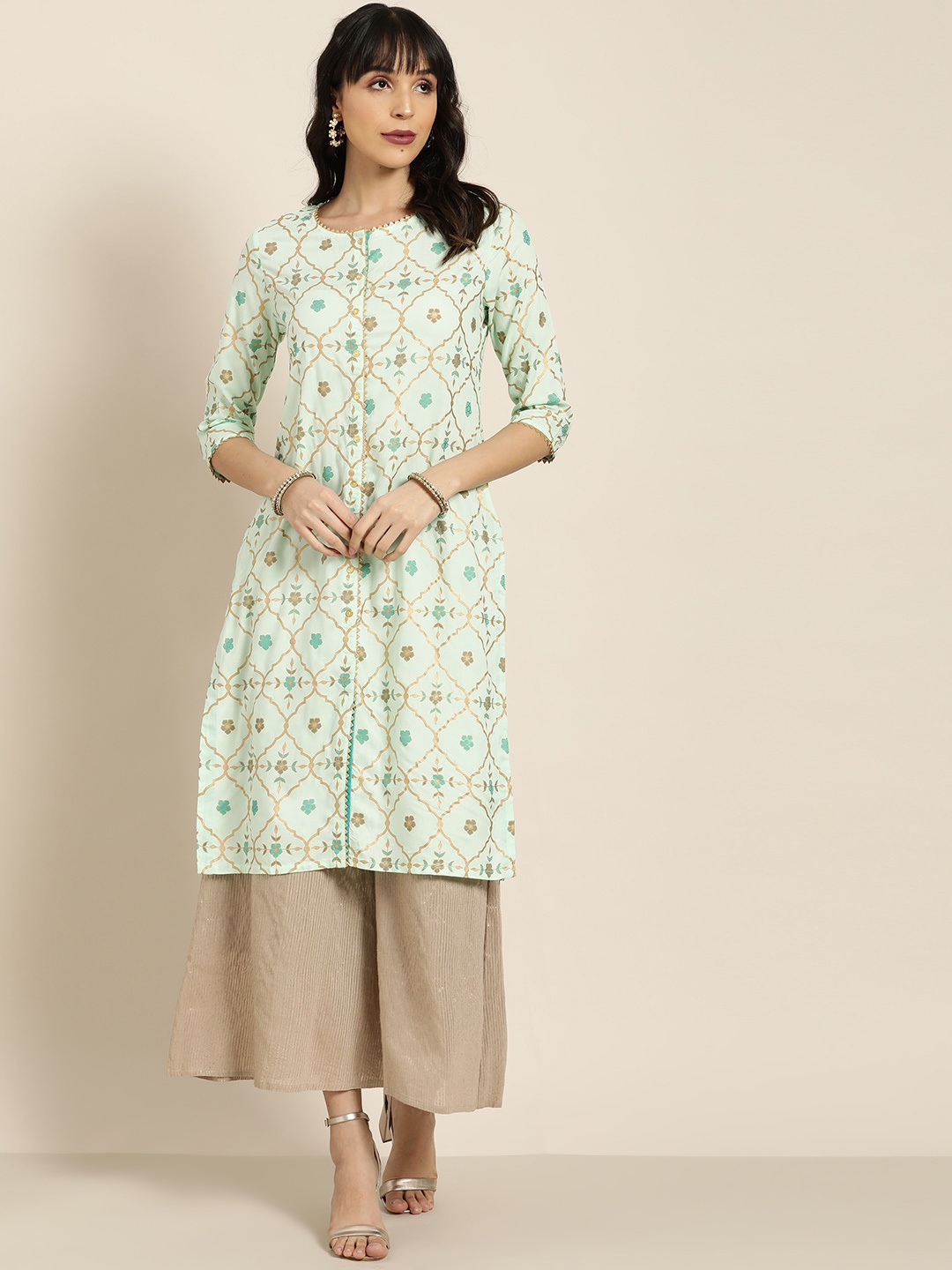 

Moda Rapido Women Sea Green & Golden Printed Straight Kurta