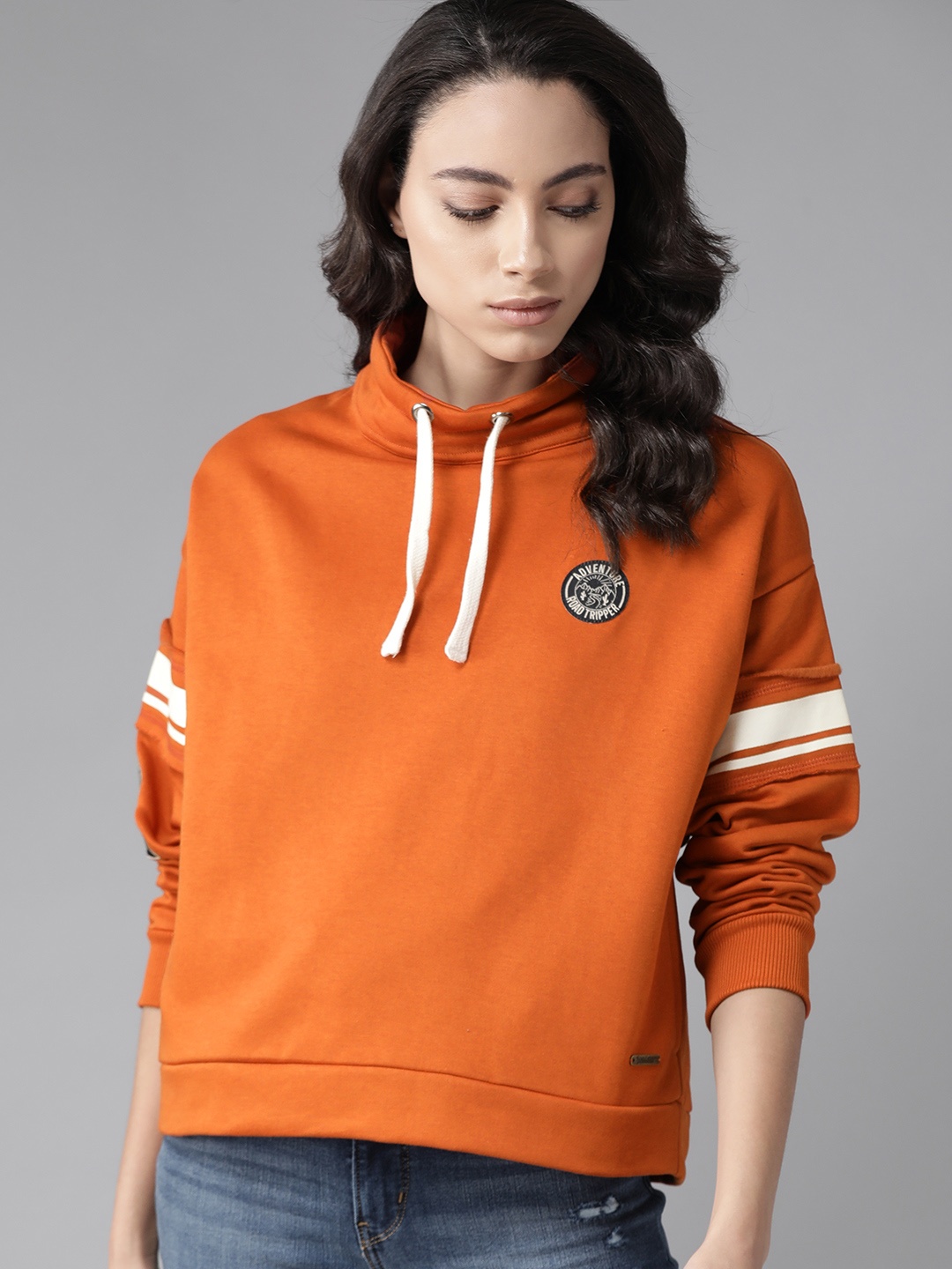 

Roadster Women Orange Solid Sweatshirt