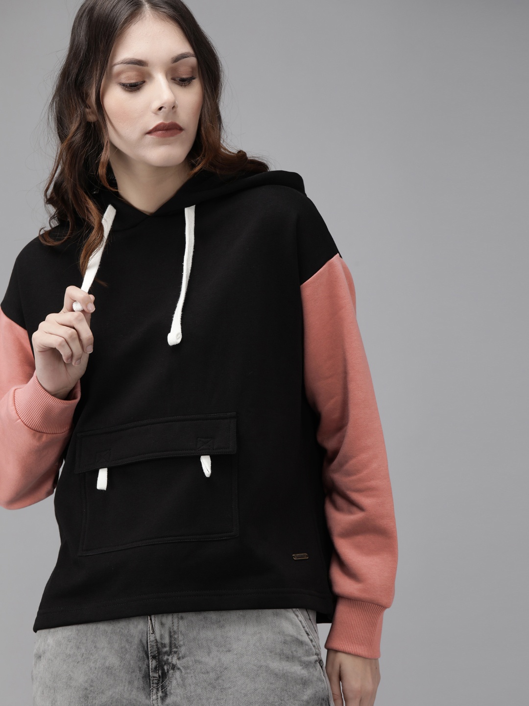 

Roadster Women Black & Pink Solid Hooded Sweatshirt
