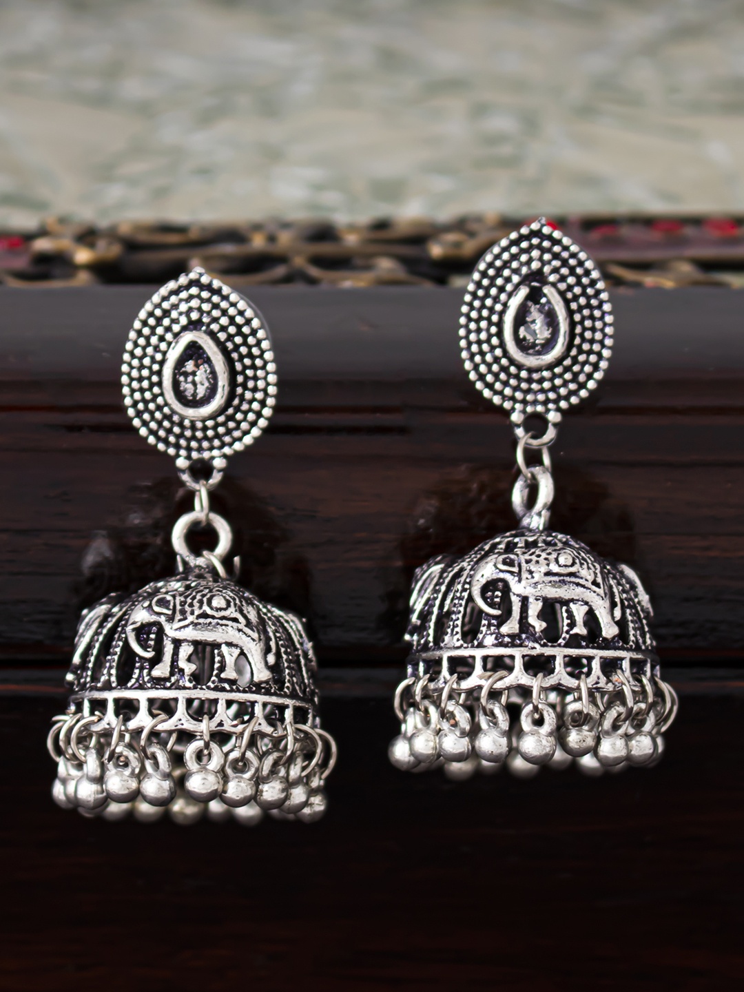 

Sukkhi Silver-Toned Rhodium-Plated Oxidised Dome Shaped Jhumkas