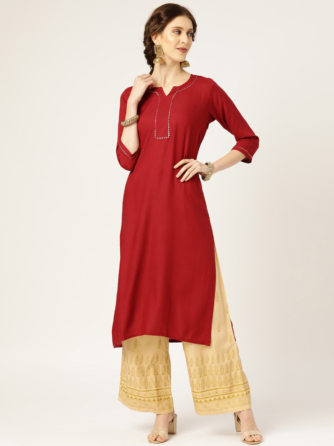 

Shae by SASSAFRAS Women Maroon Solid Straight Kurta