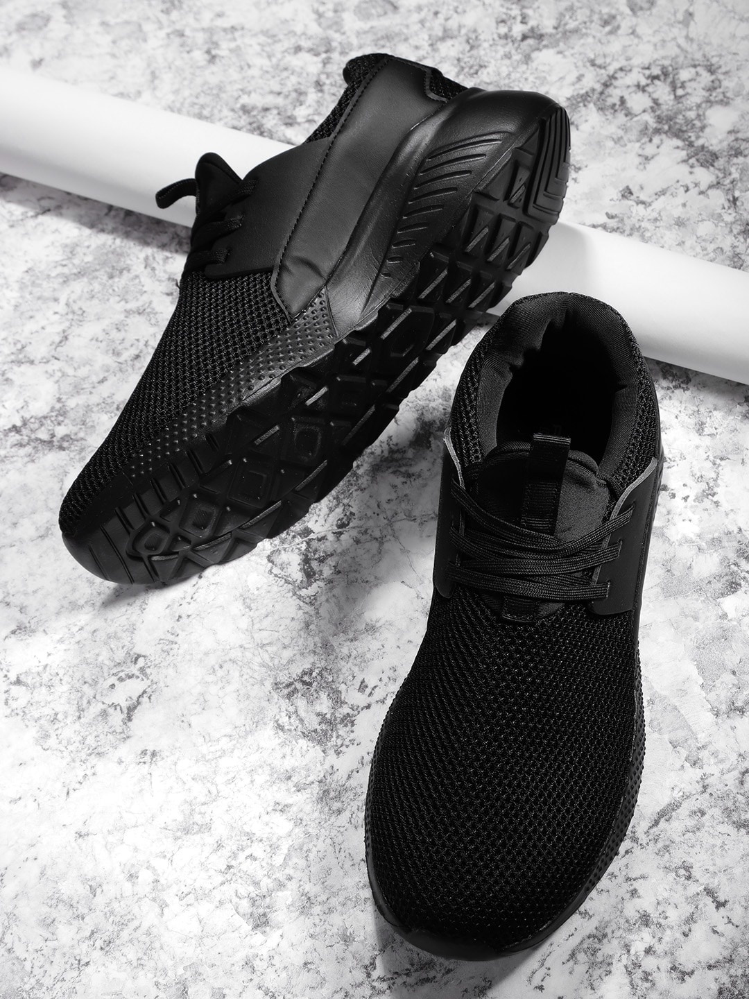 

Roadster Men Black Solid Sneakers