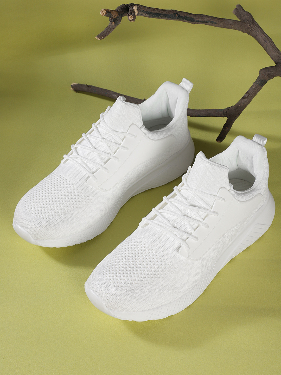 

Roadster Men White Solid Running Shoes