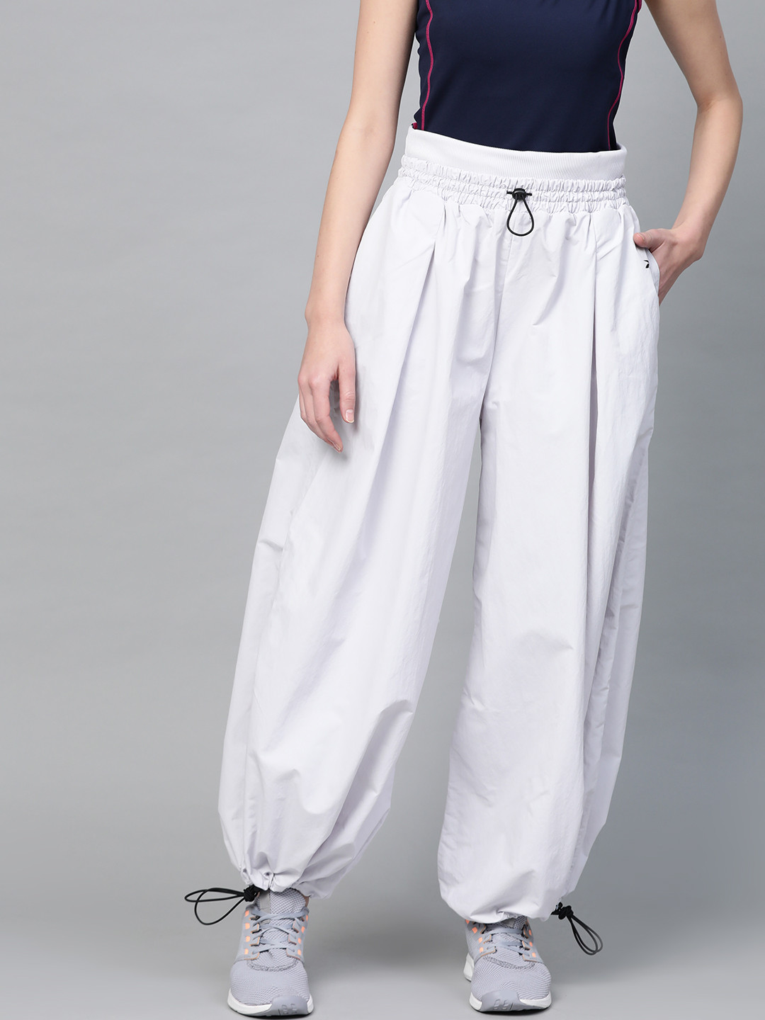 

Women Reebok Off-White Solid High-Rise Studio Track Pants