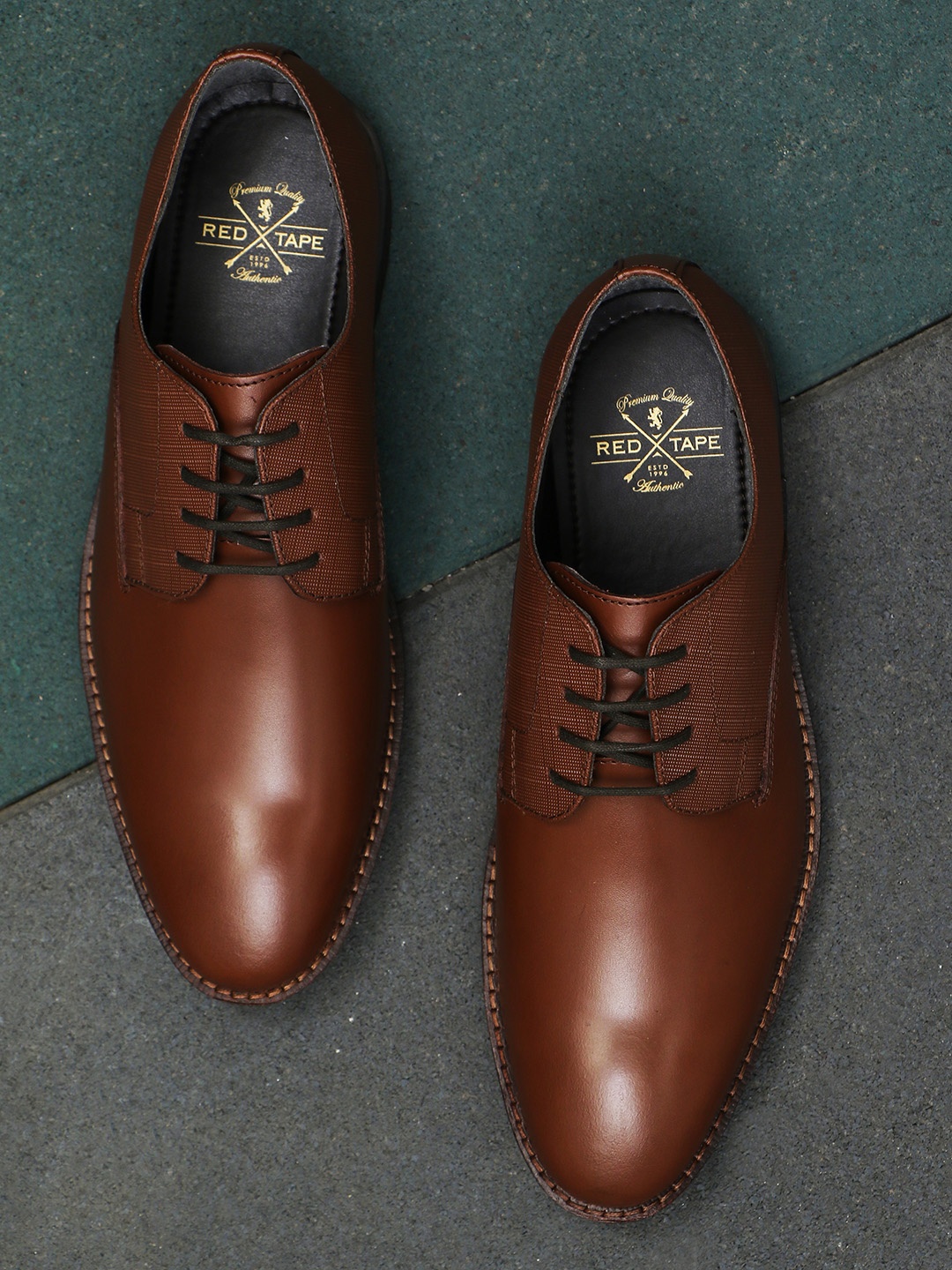 

Red Tape Men Brown Solid Leather Formal Derbys
