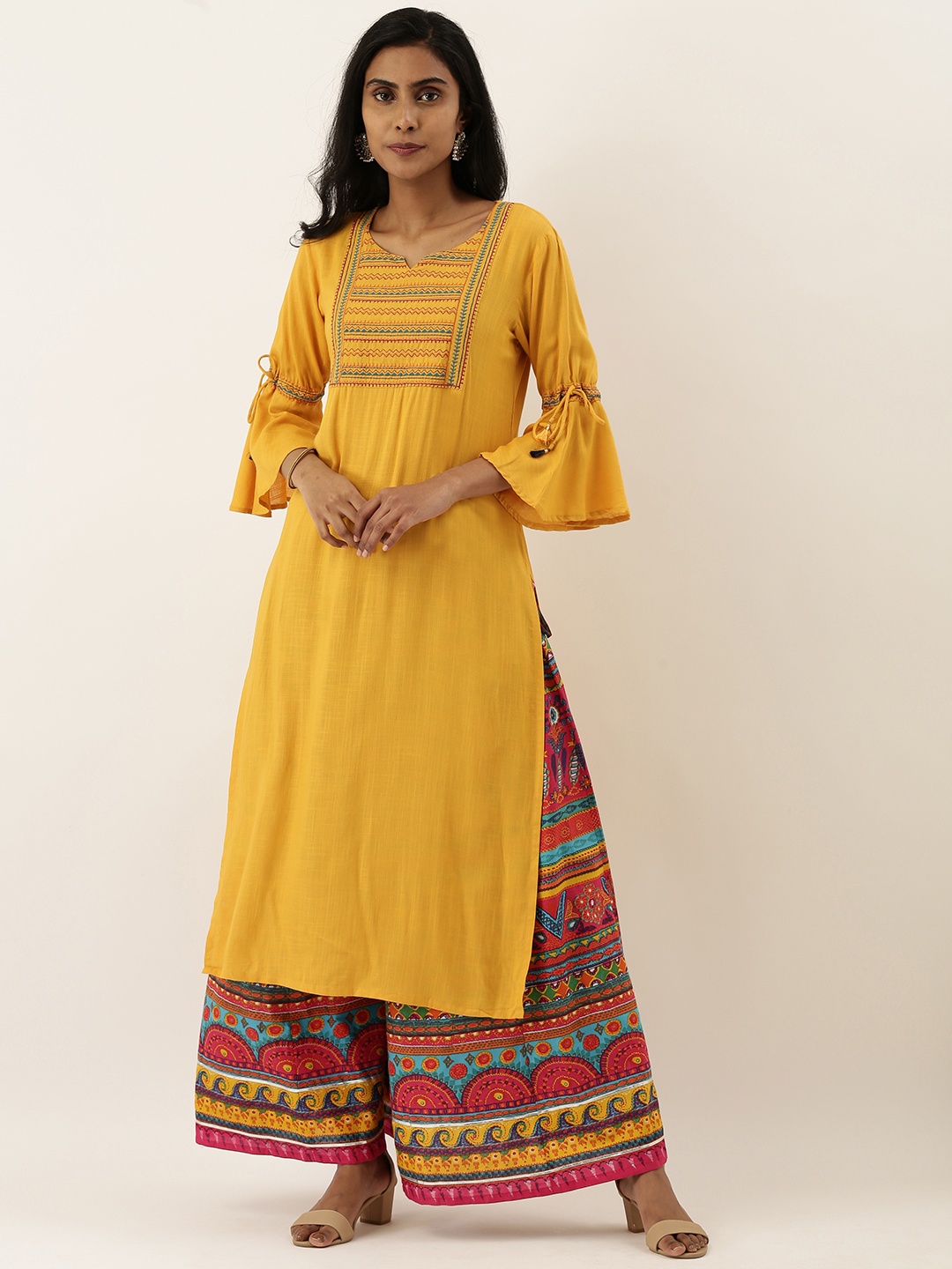 

Varanga Women Mustard Yellow & Multicoloured Solid Kurta with Palazzos