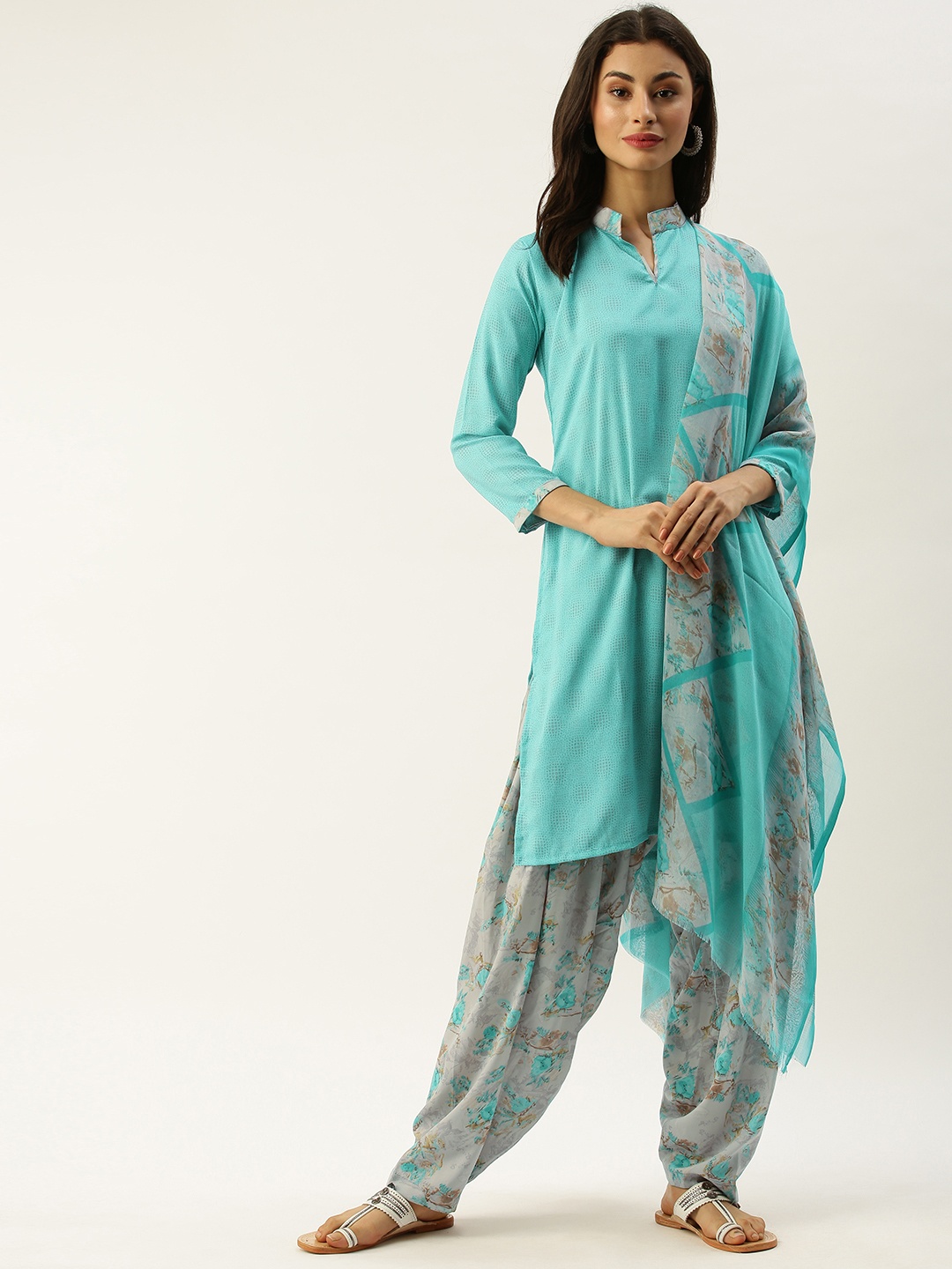 

Rajnandini Turquoise Blue & Grey Poly Crepe Unstitched Dress Material