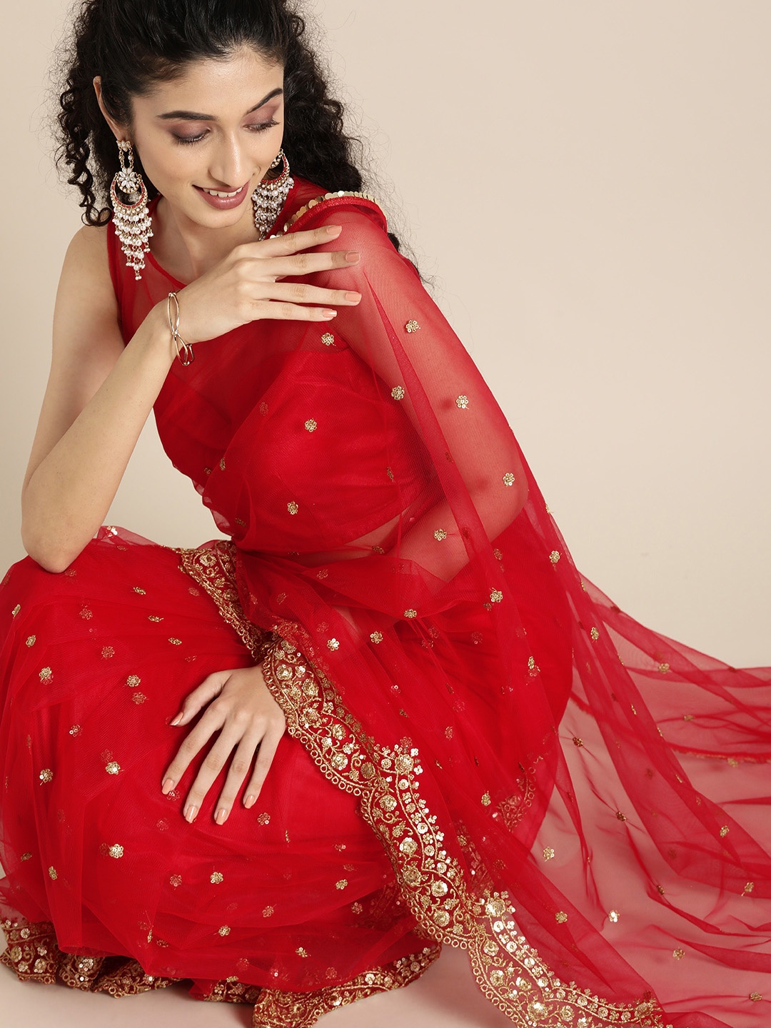 

Inddus Red & Gold-Toned Net Embroidered Saree