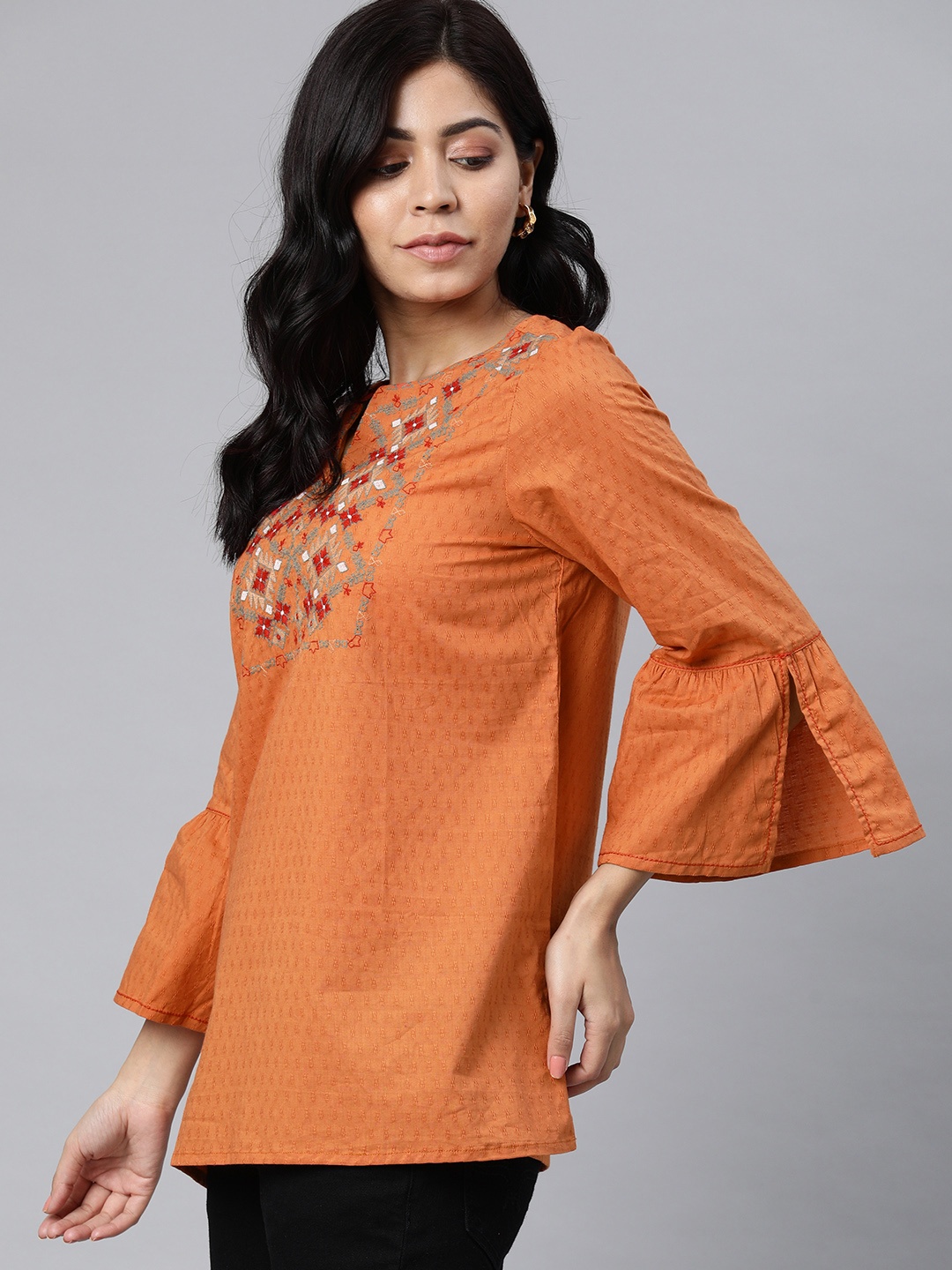 

Global Desi Women Orange Embroidered Bell Sleeved Longline Pure Cotton Top