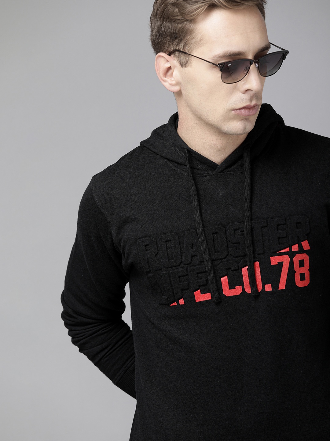 

Roadster Men Black & Orange Solid Hooded Sweatshirt