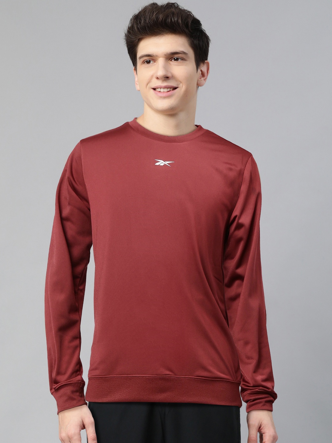 

Reebok Men Rust Red Solid Foundation Training Sweatshirt