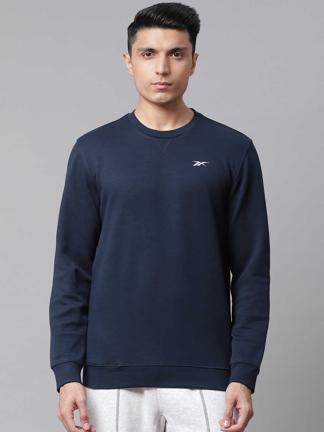 

Reebok Men Navy Blue Solid Sweatshirt