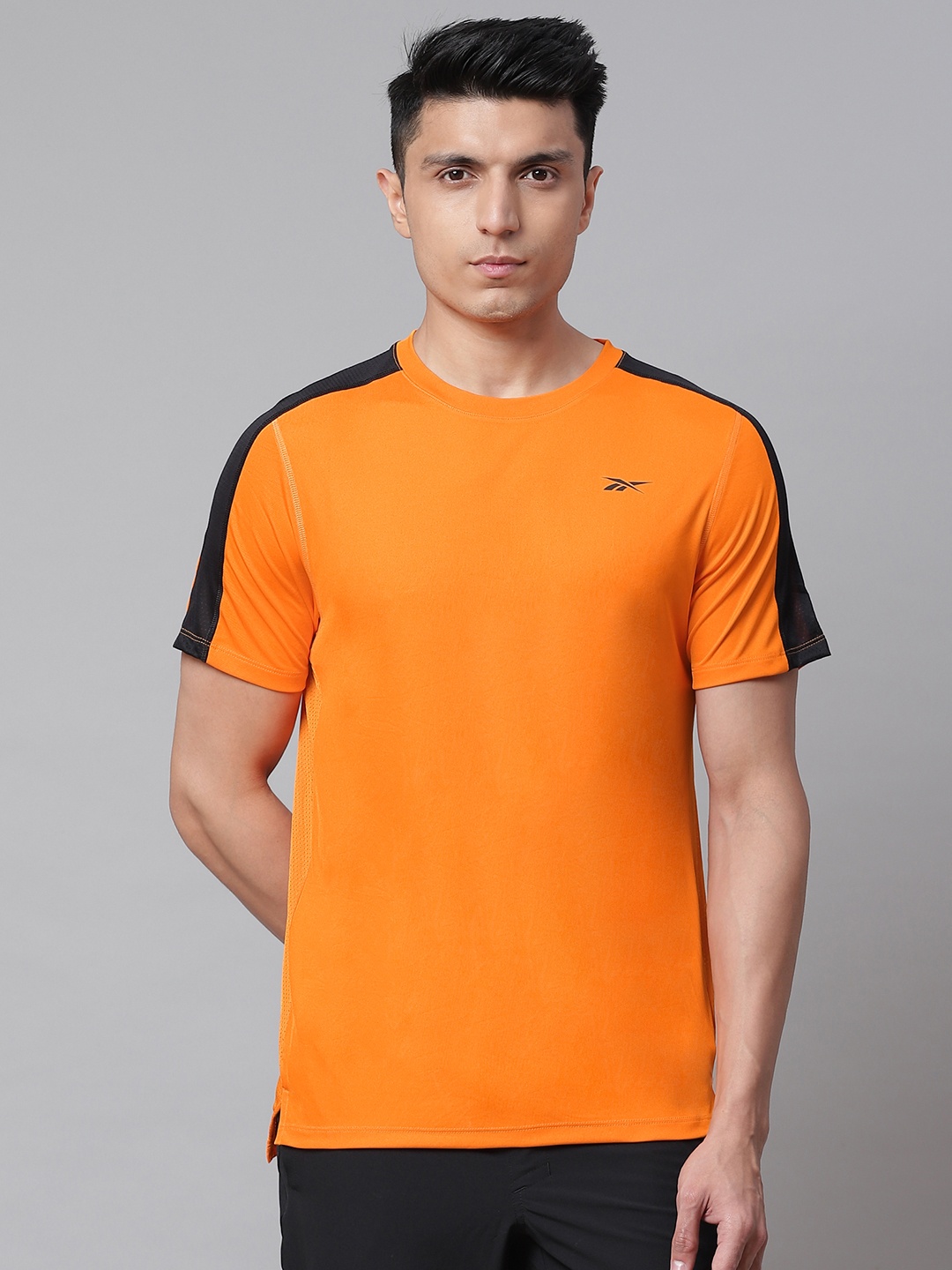 

Reebok Men Orange Solid Workout Ready Tech T-shirt