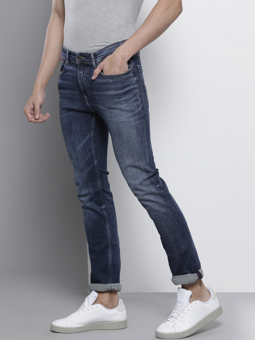 

Tommy Hilfiger Men Blue Slim Fit Mid-Rise Heavy Fade Clean Look Stretchable Jeans