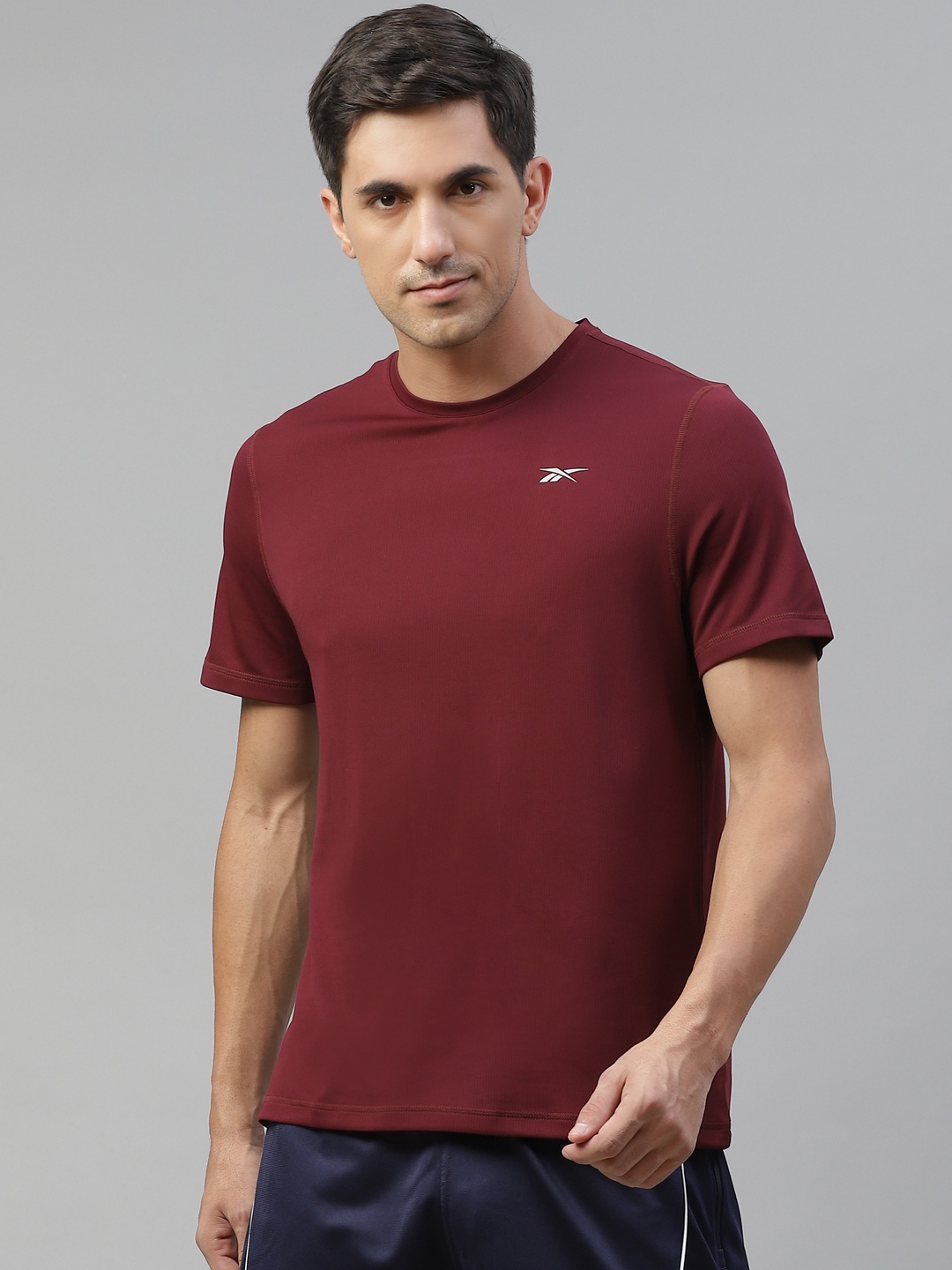 

Reebok Men Maroon Solid Essentials Short Sleeve Speedwick Running T-shirt