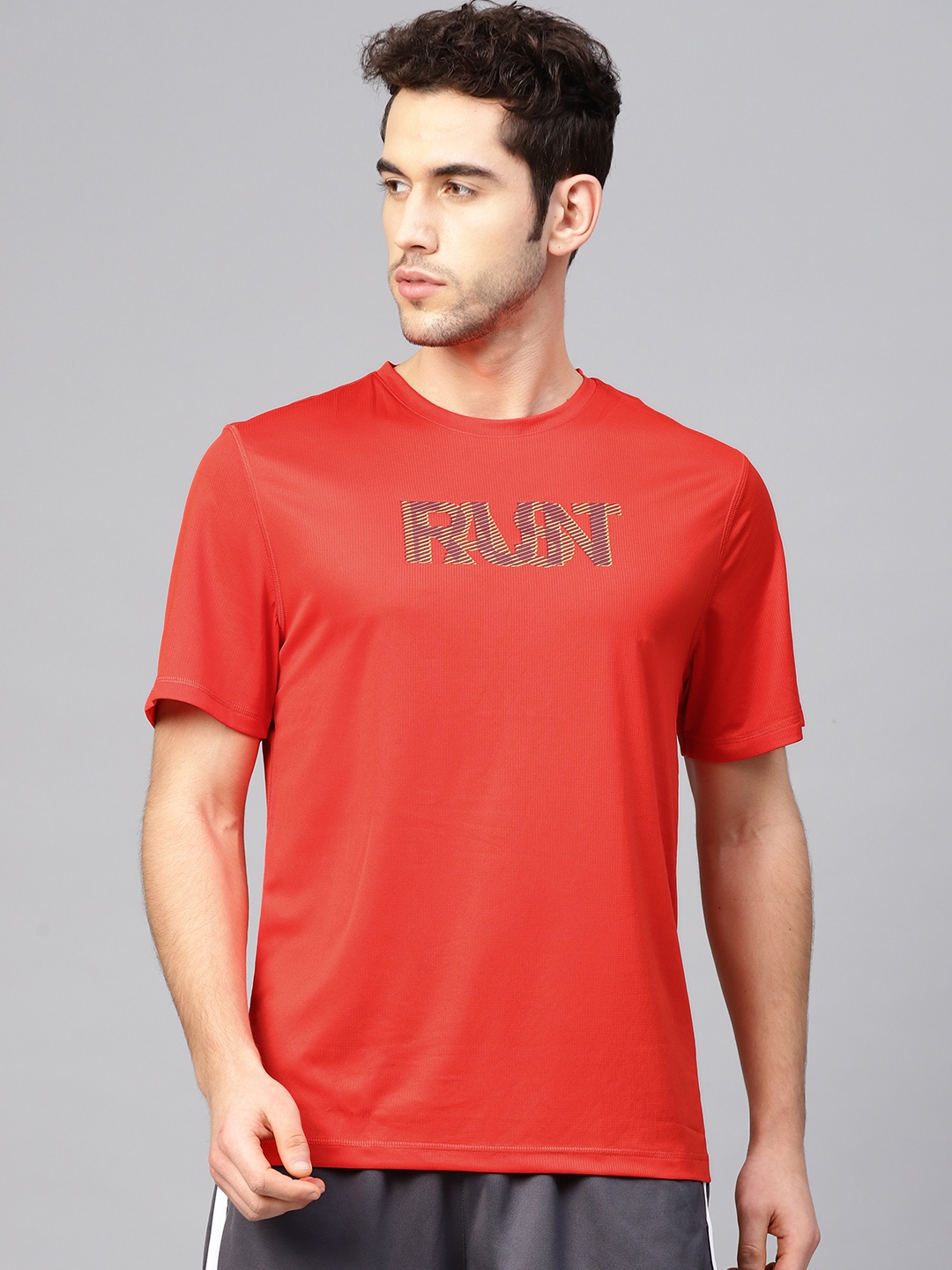 

Reebok Men Red & Blue Self Design Essentials Fast Running T-shirt