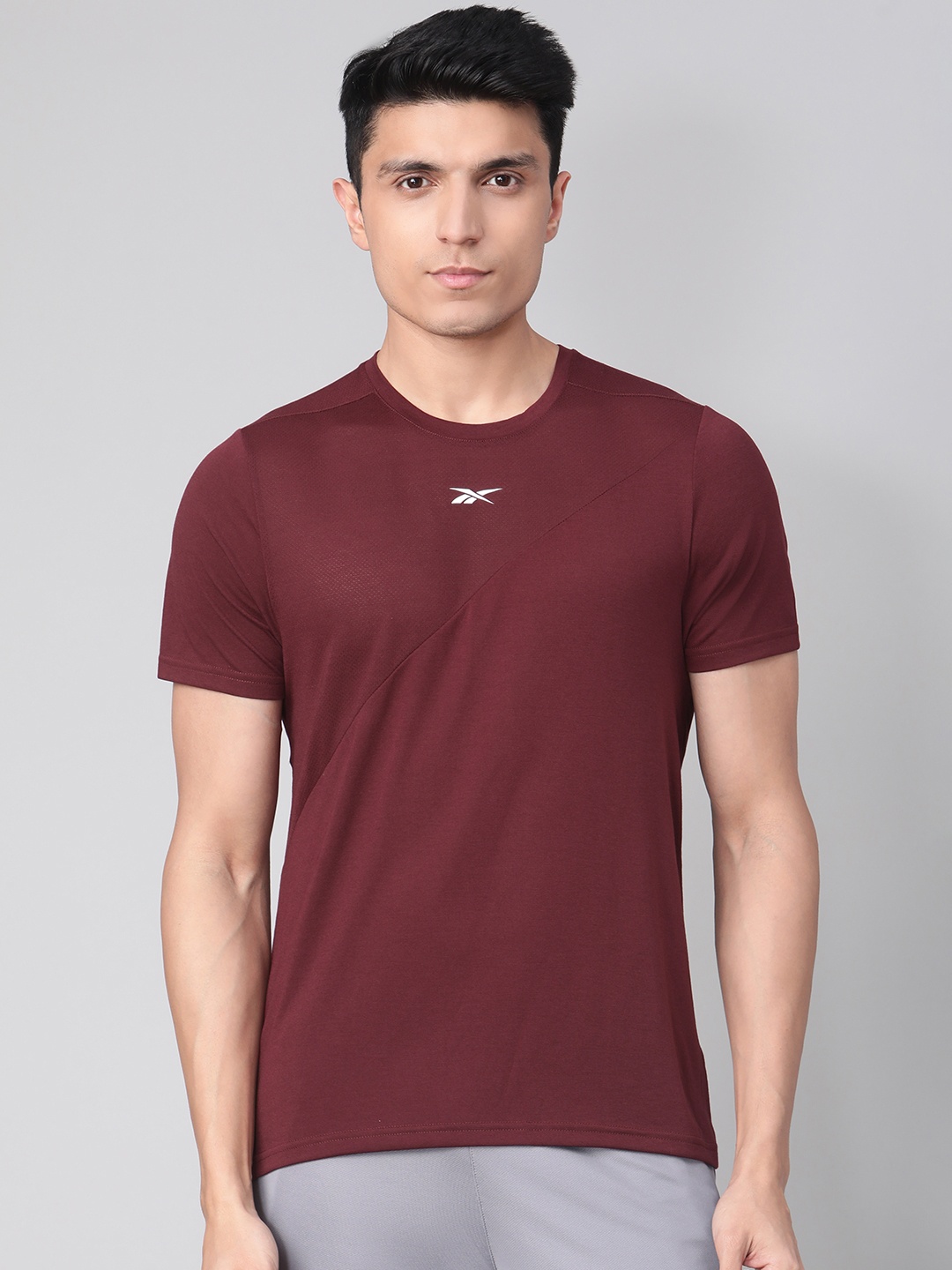 

Reebok Men Burgundy Solid Workout Ready Supremium Training T-shirt