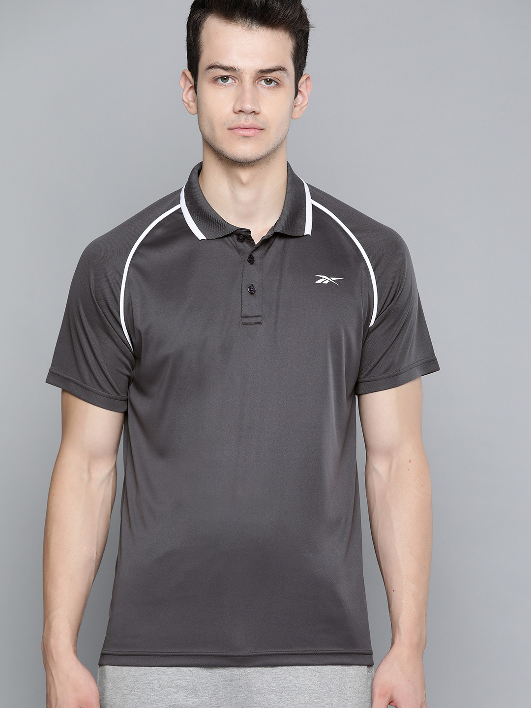 

Reebok Men Charcoal Grey Solid Training RAG Polo TEE