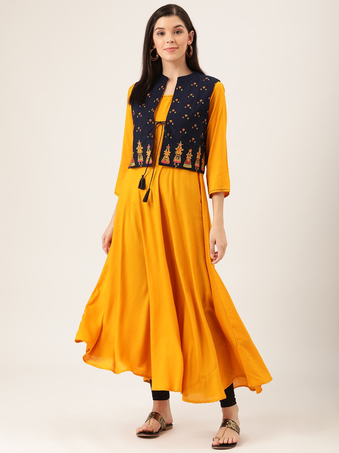 

Prakrti Women Mustard Yellow Solid A-Line Asymmetric Kurta With Embroidered Jacket