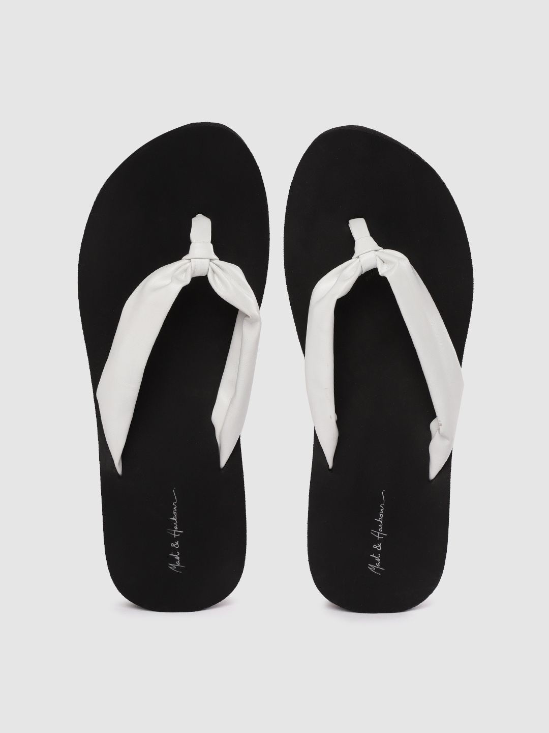 

Mast & Harbour Women White & Black Solid Thong Flip-Flops with Knot Detail
