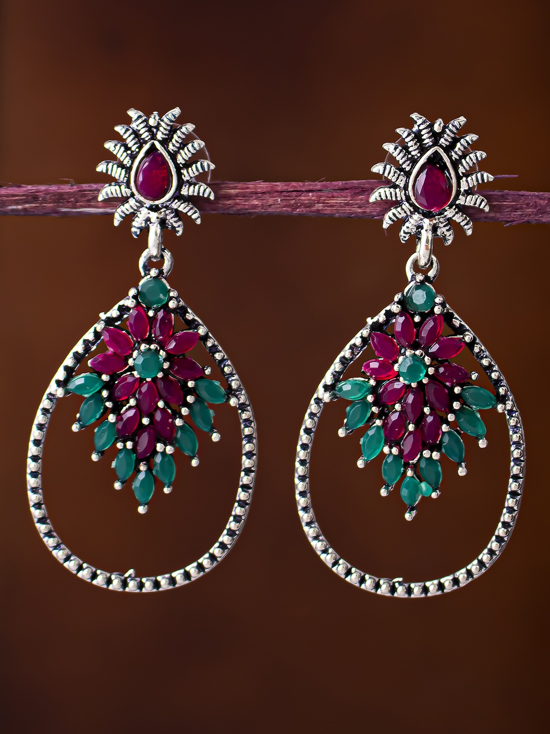 

Sukkhi Pink & Green Handcrafted Oxidised Teardrop Shaped Drop Earrings