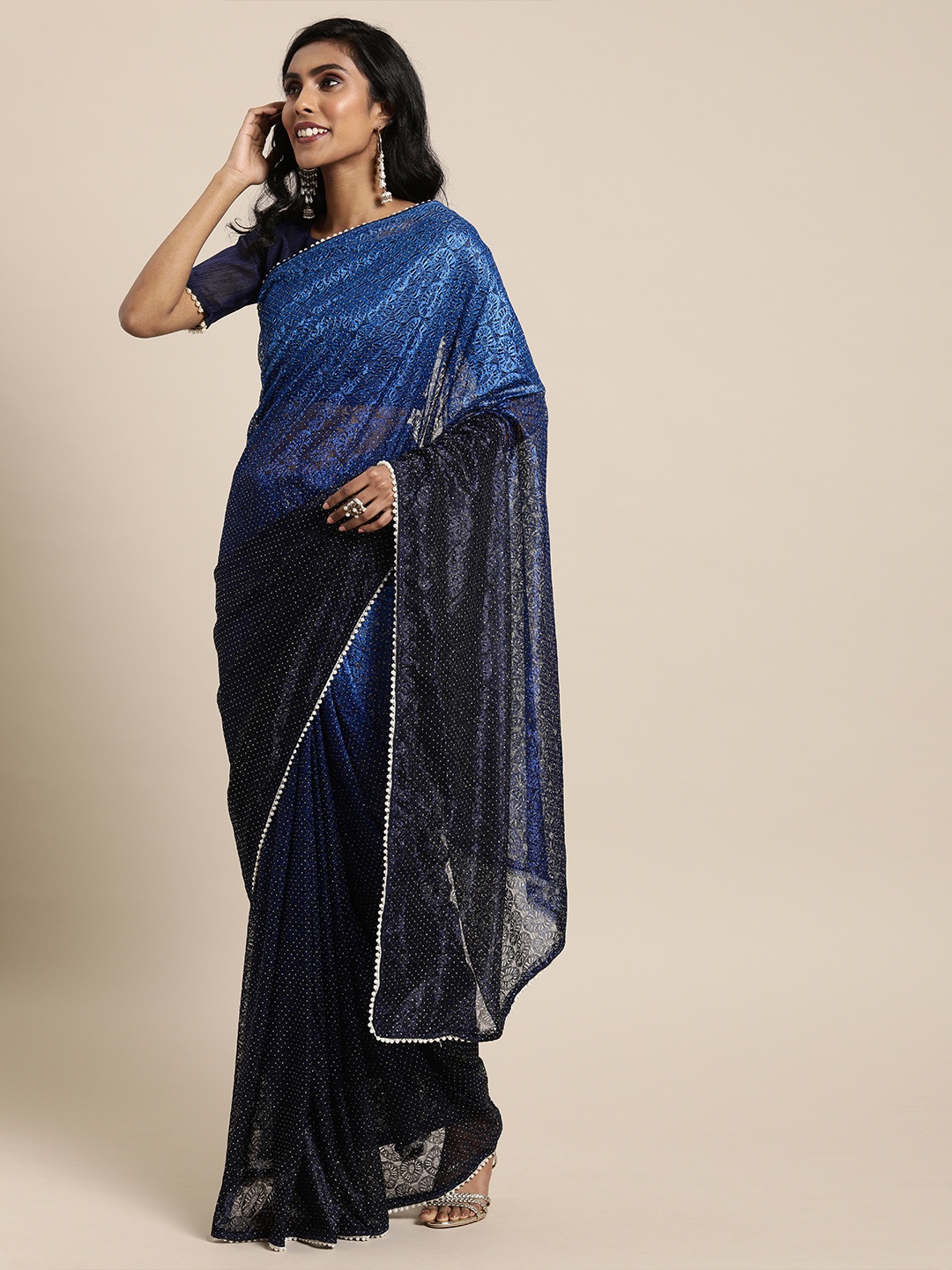 

Mitera Blue Net Woven Design Embellished Saree