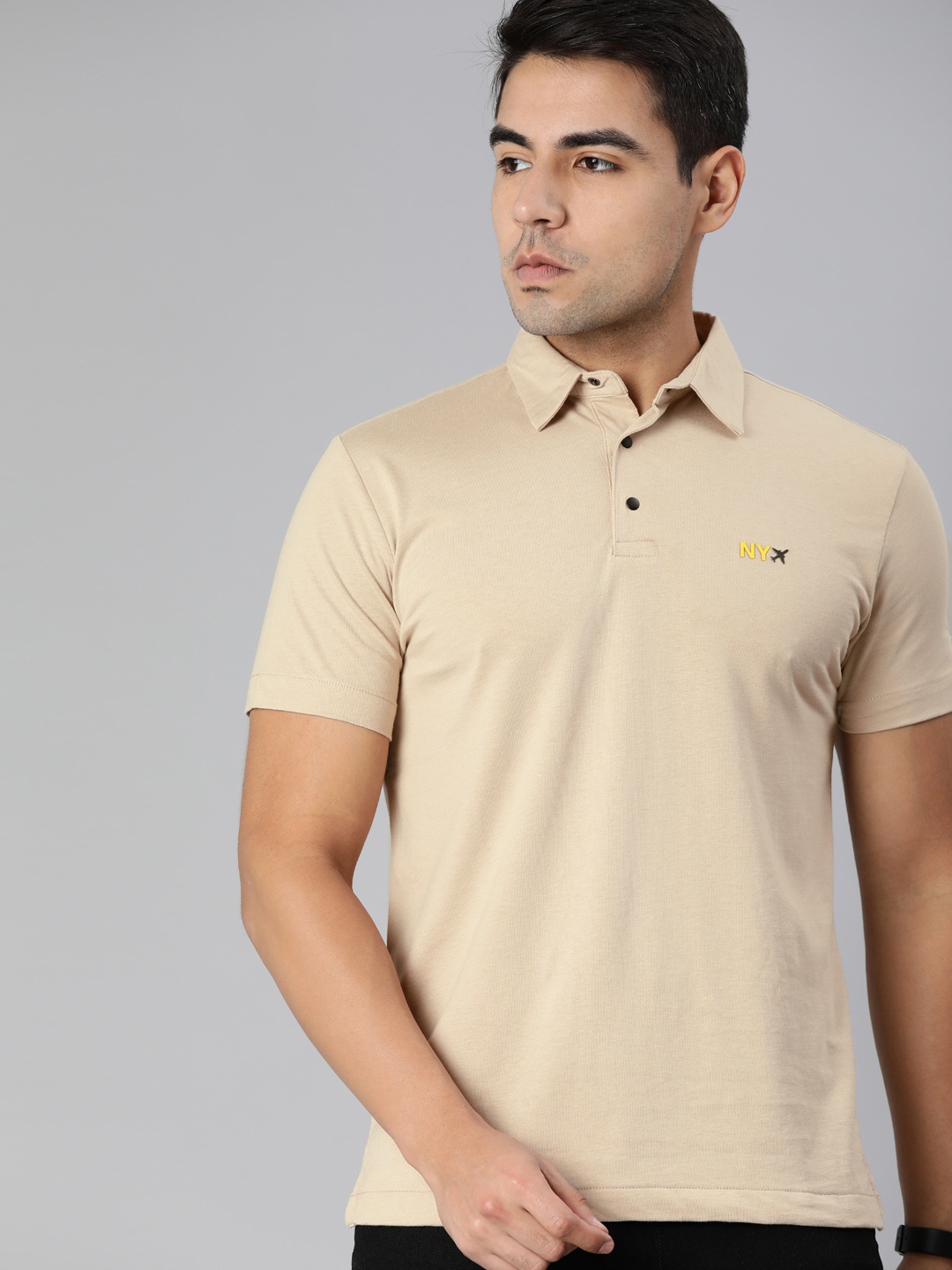 

Arrow New York Men Beige Solid Polo Collar T-shirt