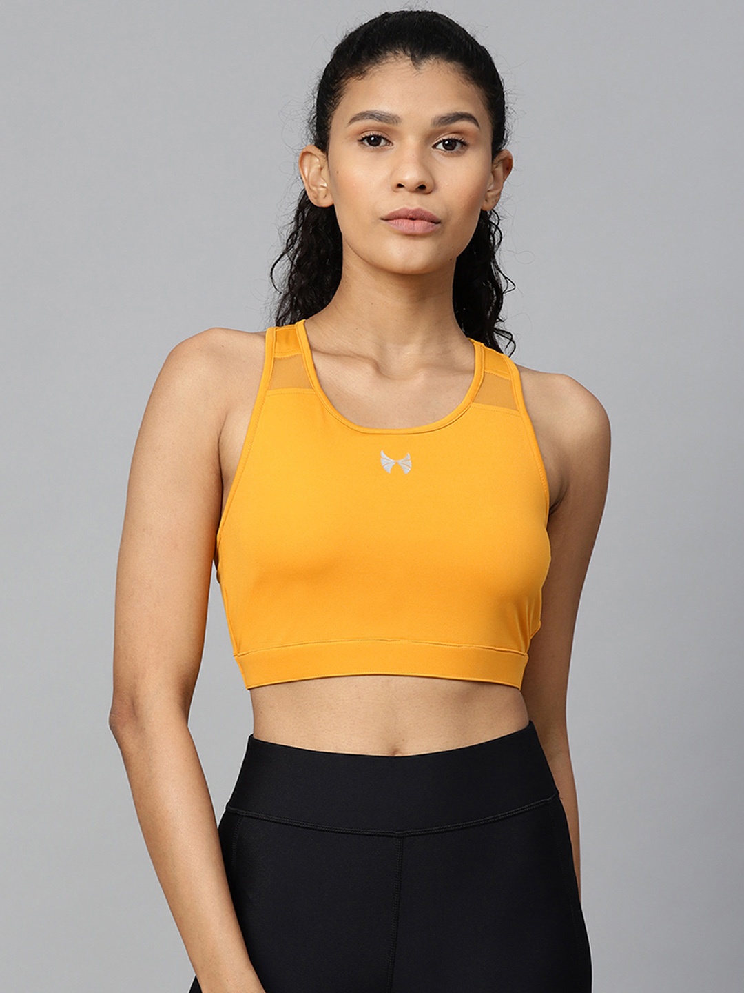 

Skyria Women Mustard Yellow Solid Non-Wired Non Padded Rapid Dry Sports Bra SSU011F2XS