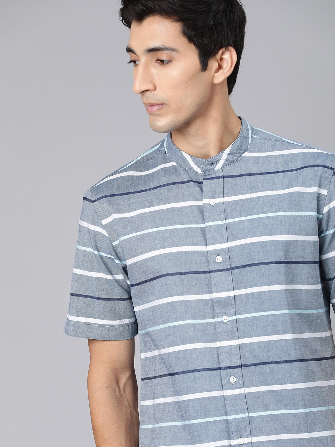 

Tommy Hilfiger Men Blue & White Striped Regular Fit Casual Shirt