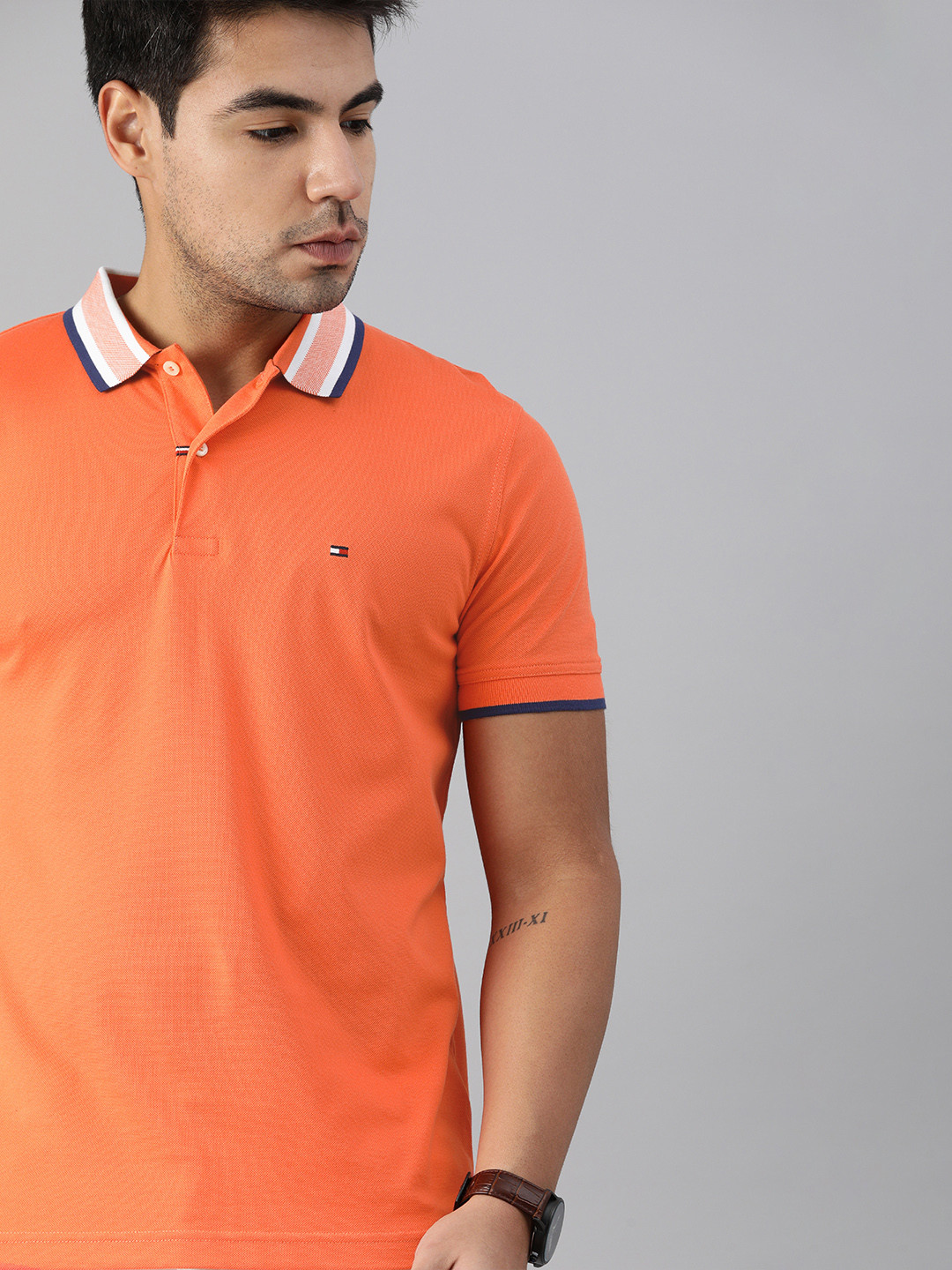 

Tommy Hilfiger Men Orange Solid Polo Collar Pure Cotton T-shirt