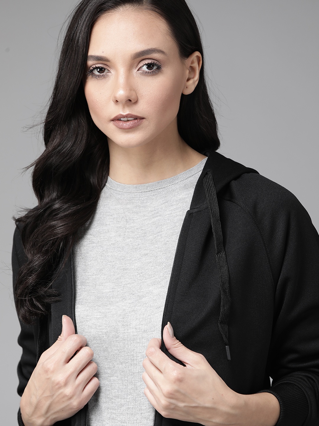 

Roadster Women Black Solid Hooded Front Open Sweatshirt Convertible Into a Bag