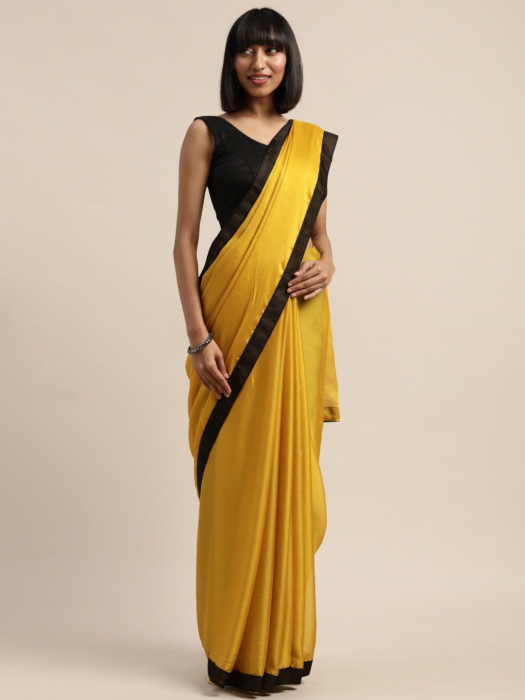 

Mitera Mustard Yellow Solid Poly Chiffon Saree