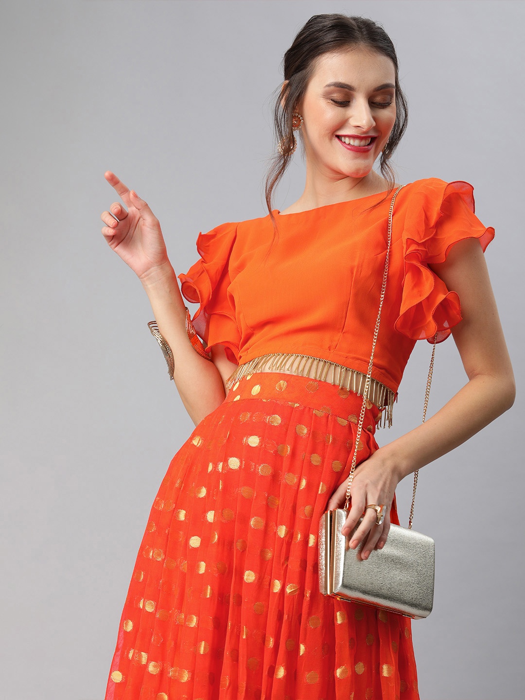 

Inddus Women Orange Solid Embellished Detail Crop Top with Woven Design Skirt