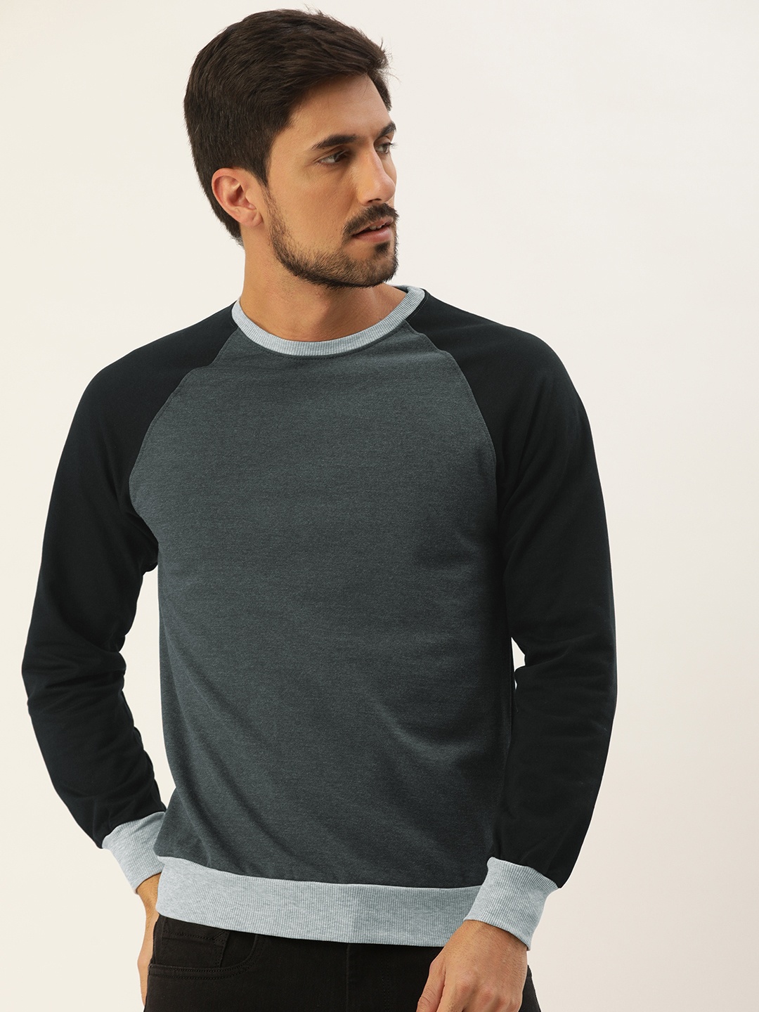 

Campus Sutra Men Charcoal Grey Solid Bio Wash Contrast Sleeve Sweatshirt