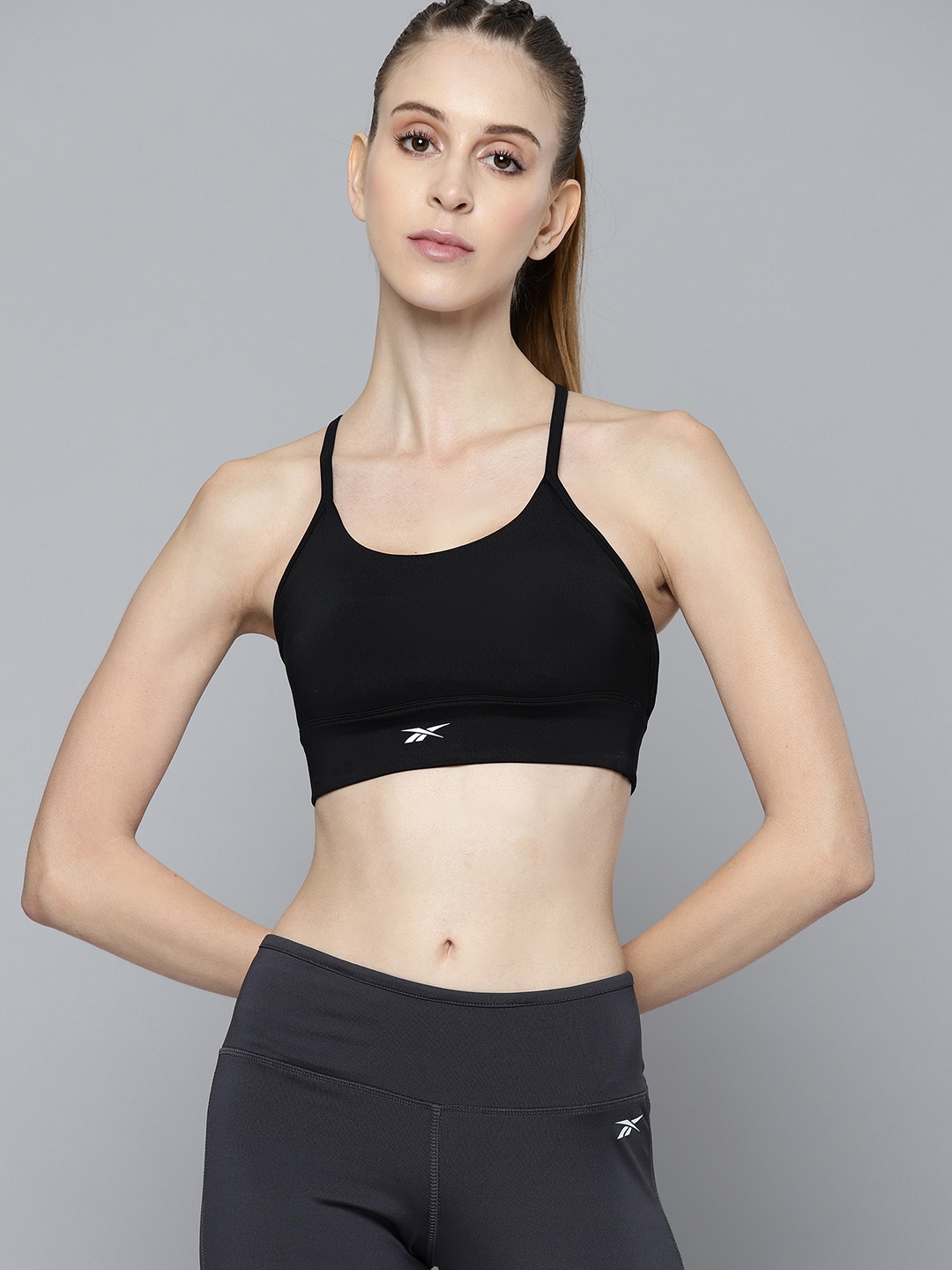 

Reebok Black Solid Lightly Padded CORE TRI Styled Back Sports Bra