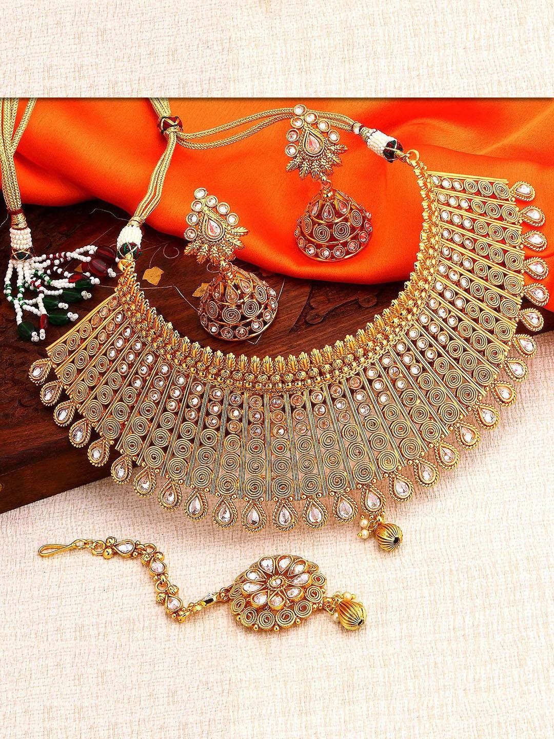 

Sukkhi Gold-Plated White Kundan-Studded Beaded Antique Jewellery Set