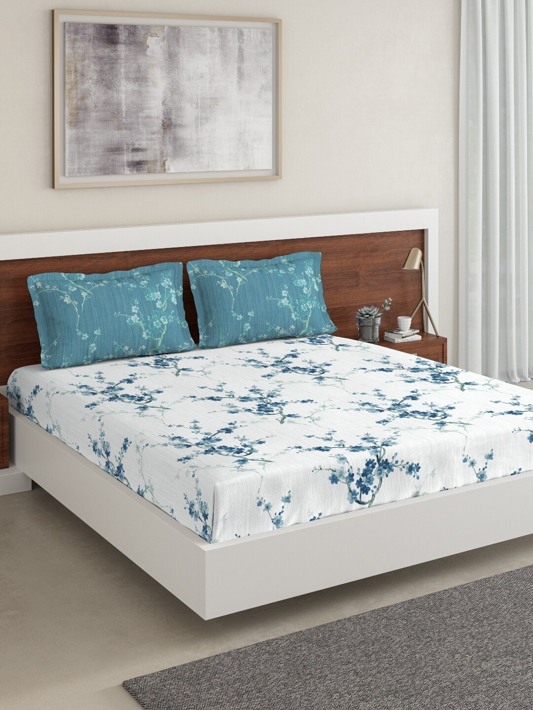 

DDecor Blue & White Floral 144 TC Cotton 1 Queen Bedsheet with 2 Pillow Covers