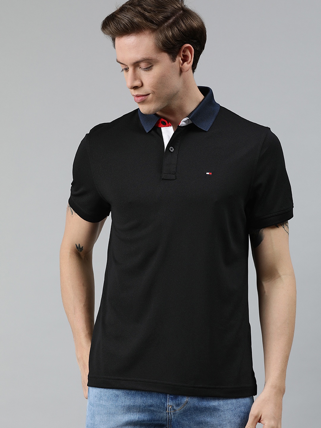 

Tommy Hilfiger Men Black Solid Polo Collar T-shirt