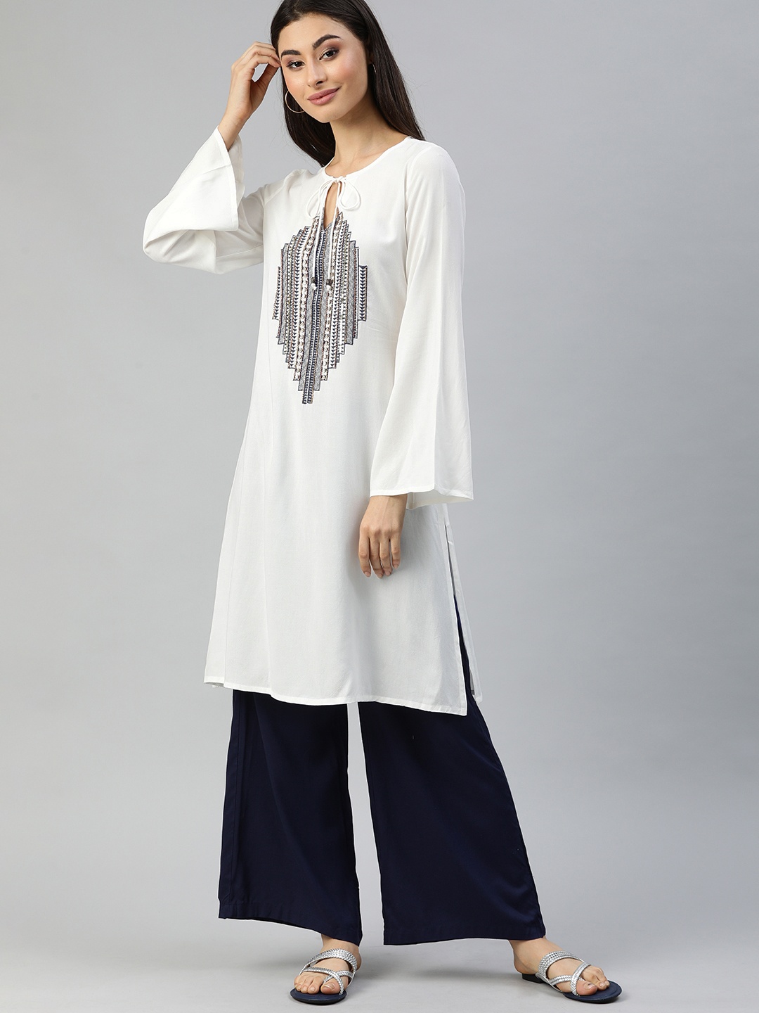 

Ishin Women White Yoke Embellished Straight Kurta with Flared Sleeves
