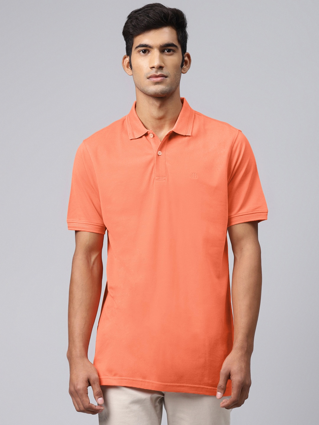 

Raymond Men Orange Solid Supima Cotton Polo Collar T-shirt
