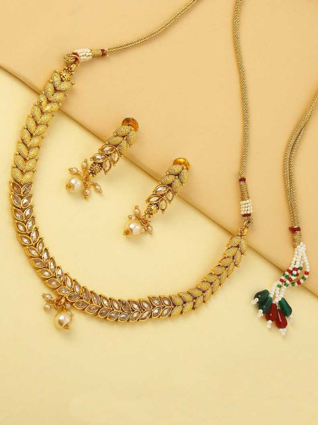 

Priyaasi Gold-Plated & Cream-Colored Artificial Stone-Studded With Pearl Drop Jewellery Set