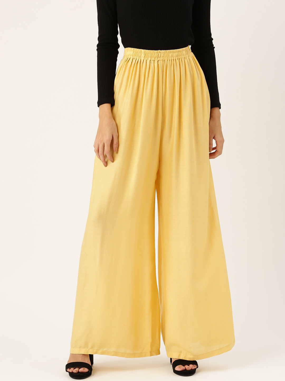 

Vastraa Fusion Women Yellow Solid Flared Palazzos