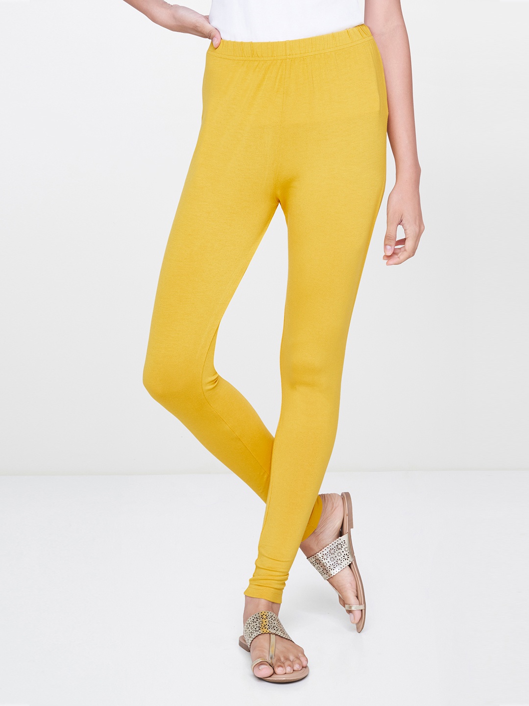 

Global Desi Women Mustard Yellow Solid Churidar Length Leggings