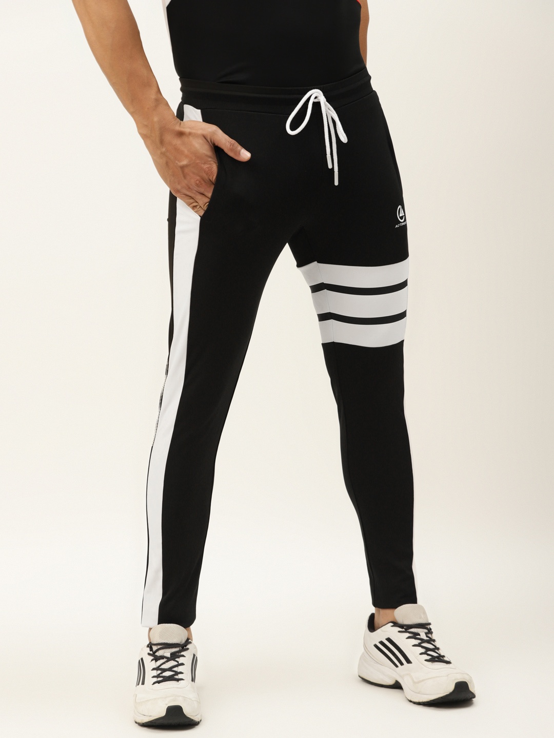 

ACTOHOLIC Men Black Solid Track Pants with Striped Detail