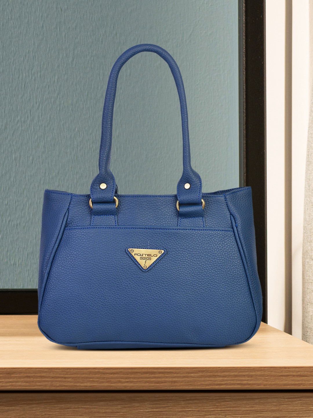 

Fostelo Blue Solid Handheld Bag